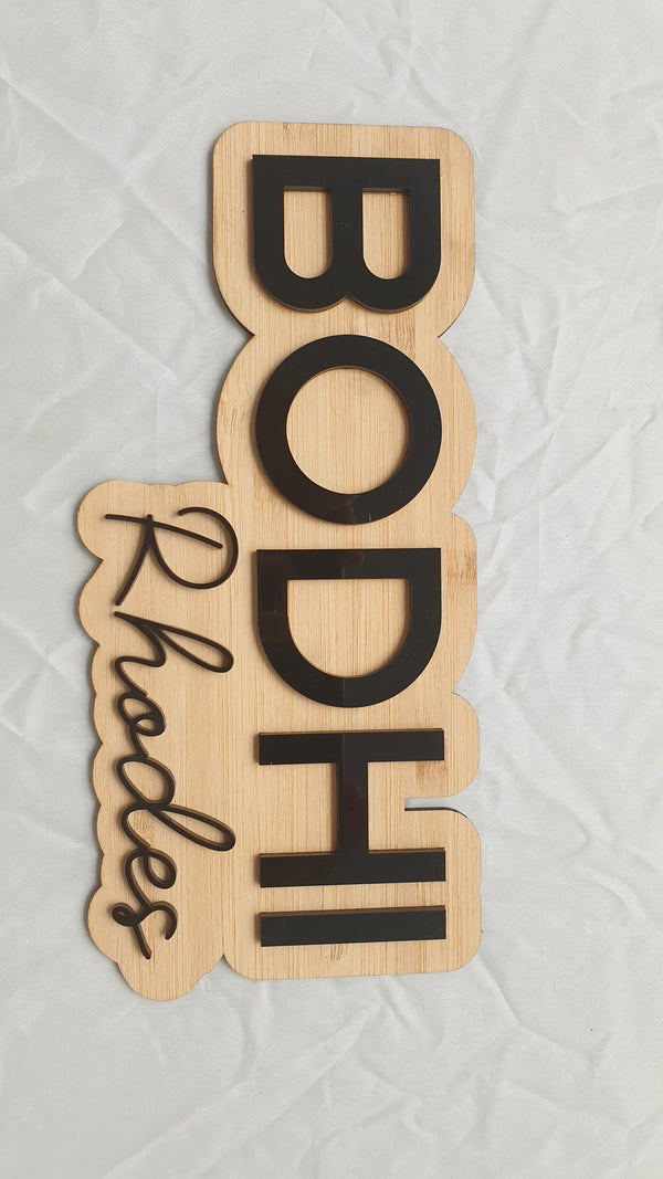 Layered bamboo name sign reading Bodhi Rhodes