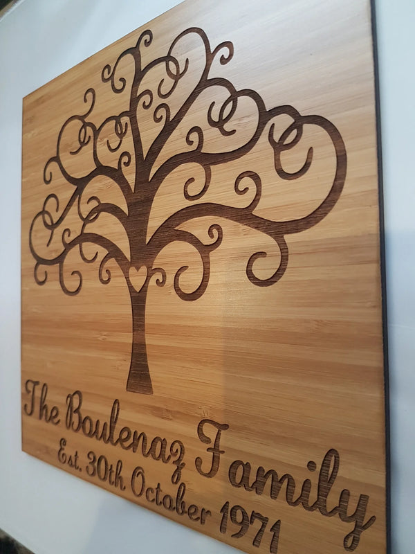 Bamboo family sign engraved with a tree of life and The Boulenaz Family, shown at an angle