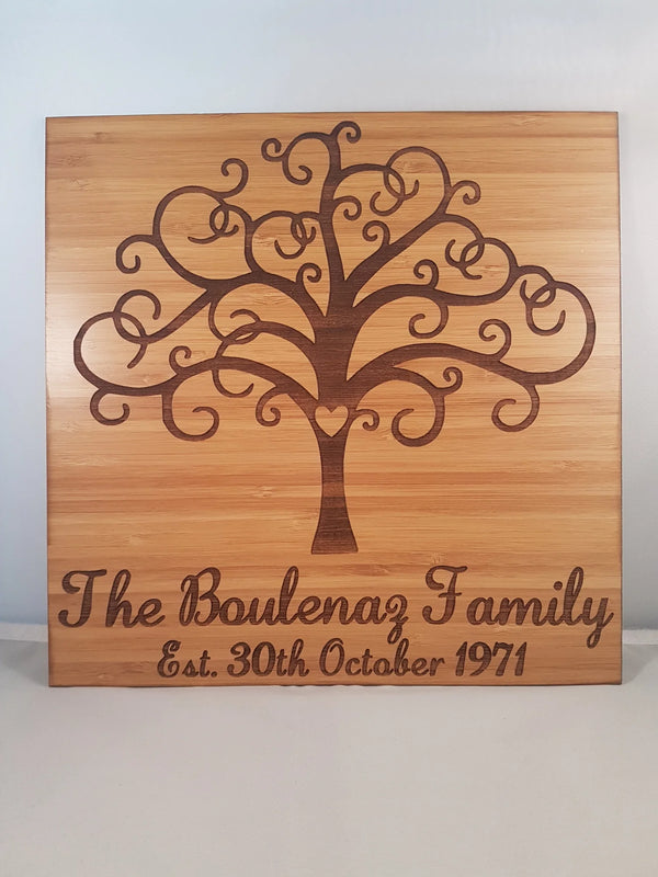 Square bamboo family sign engraved with a tree of life and the words The Boulenaz Family, Est. 30th October 1971
