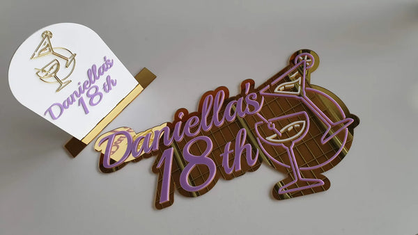Purple and gold Daniella's 18th cocktail sign and matching table topper