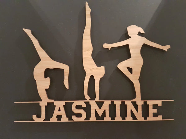 Cut-out timber gymnast sign with the name Jasmine