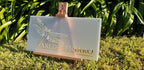 Arline Figaro Photography frosted acrylic sign with gold mirror dragonfly on a small easel