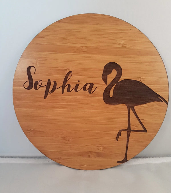 Round bamboo name plaque reading Sophia with an engraved flamingo